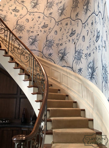 Beautiful monumental scale wallpaper from Zoffany. The modernized wallpaper is inspired by an 18th century English toile. Perfectly complementing the tall & curve staircase.