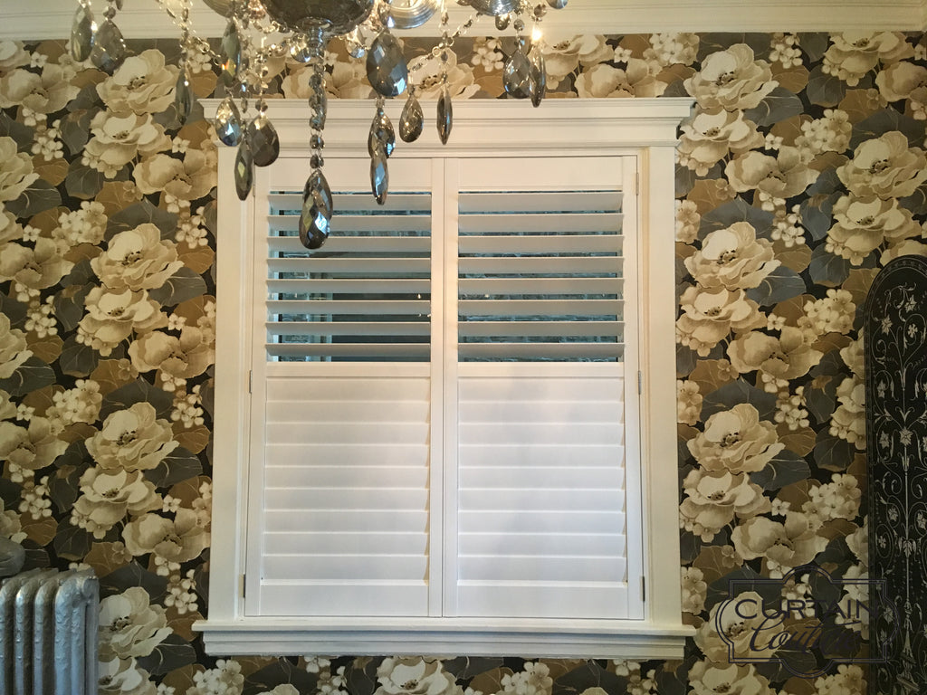 Hunter Douglas NewStyle shutters compliments elegantly with the beautiful floral wallpaper. Designed by Curtain Couture.