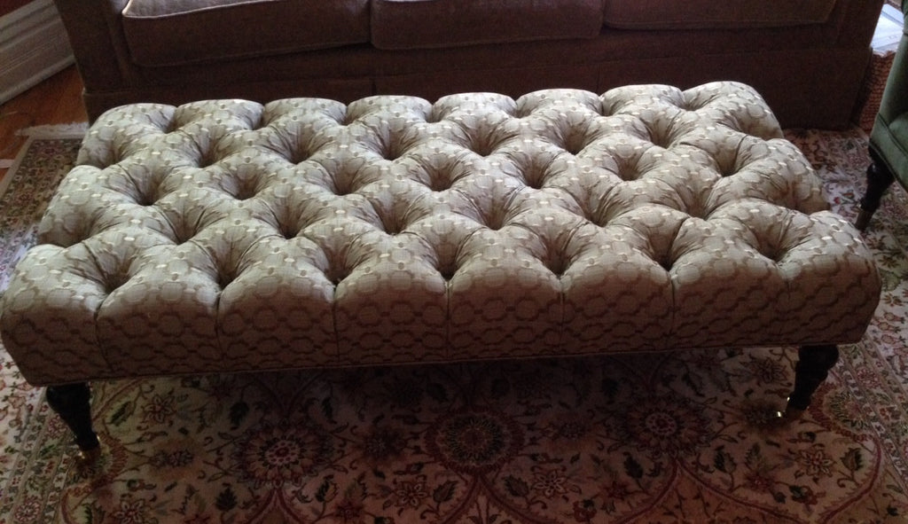 Deep tufted ottoman by Curtain Couture